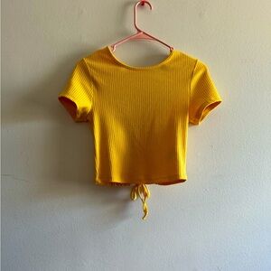 Yellow beautiful shirt with design on back size small